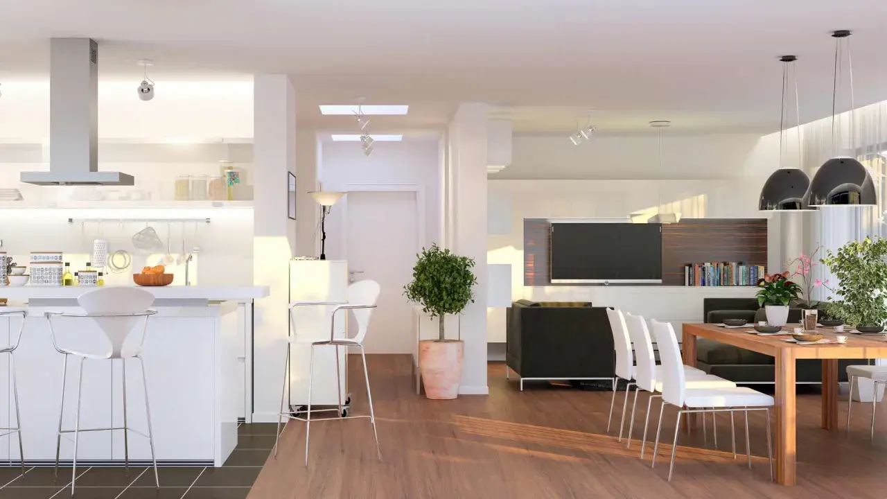 Ampio open space moderno con cucina, zona pranzo e soggiorno. Tavolo in legno con sedie bianche, divano nero, TV e libreria.